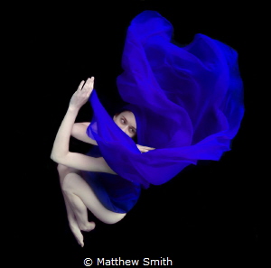 Natural lighting in a pool with a black weighted back cloth. by Matthew Smith 
